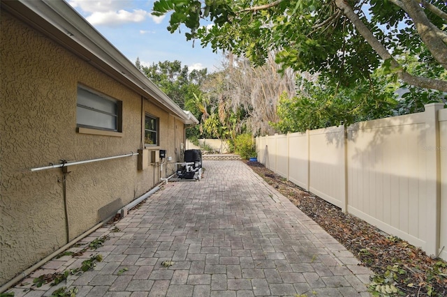 view of property exterior featuring a patio