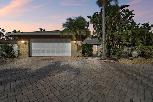 single story home featuring a garage