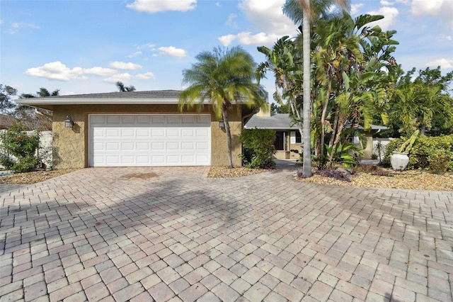 ranch-style house featuring a garage