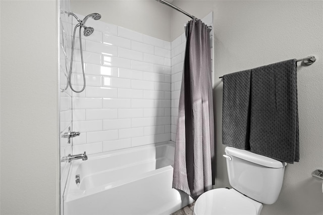 bathroom with toilet and shower / bath combo