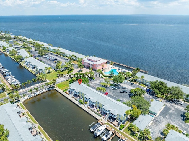 birds eye view of property with a water view