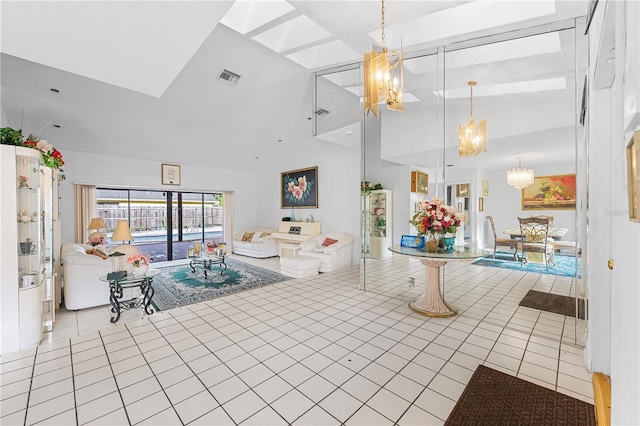 unfurnished living room featuring vaulted ceiling, a chandelier, and light tile patterned floors