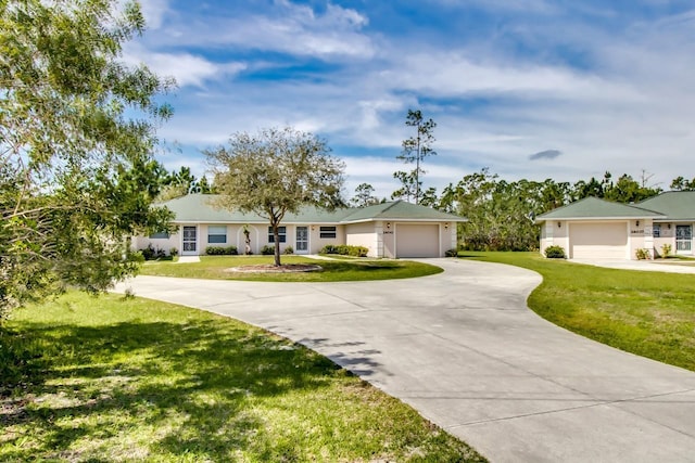 ranch-style house with a garage and a front lawn