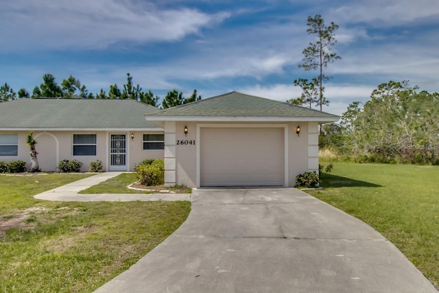 single story home with a garage and a front lawn