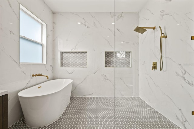 bathroom with shower with separate bathtub