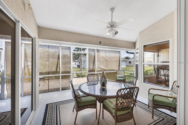 sunroom with ceiling fan