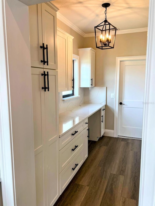 kitchen with light stone countertops, white cabinets, decorative light fixtures, dark wood-type flooring, and tasteful backsplash