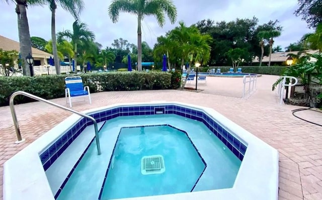 view of pool featuring a patio