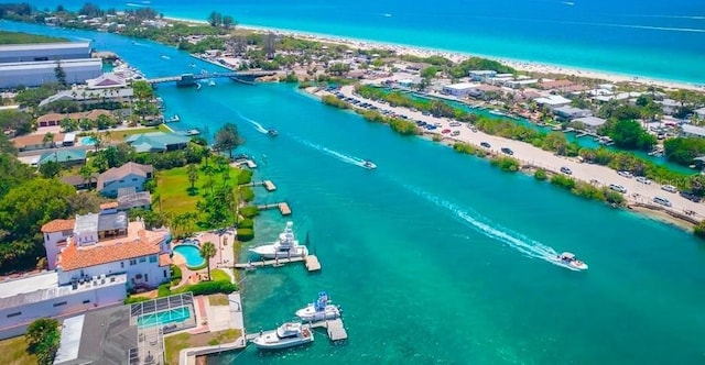 drone / aerial view with a beach view and a water view