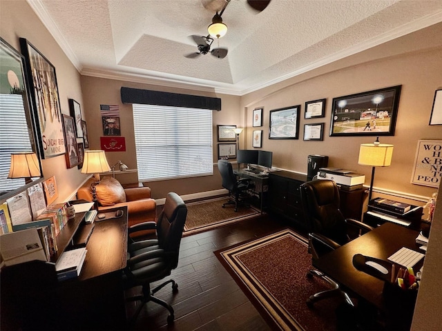 office area with a textured ceiling, a tray ceiling, dark hardwood / wood-style flooring, and crown molding