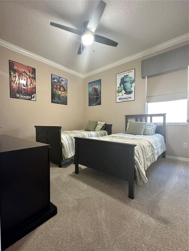 carpeted bedroom featuring a textured ceiling, ceiling fan, and ornamental molding