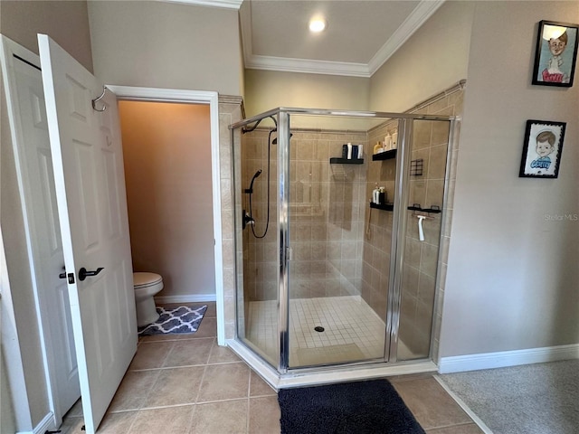 bathroom featuring toilet, tile patterned flooring, walk in shower, and ornamental molding