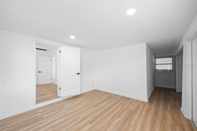 empty room with light hardwood / wood-style floors