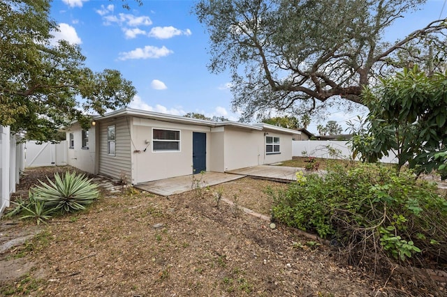 back of property featuring a patio area