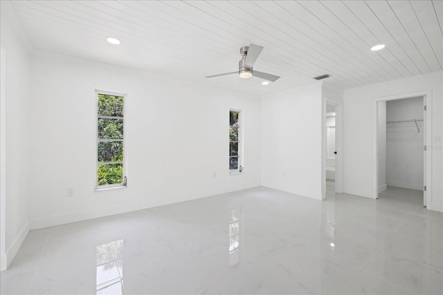 interior space with ceiling fan, wooden ceiling, and a closet