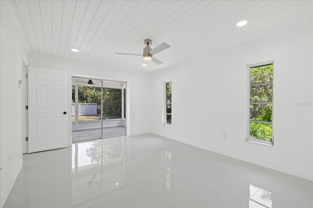 tiled empty room with wooden ceiling and ceiling fan