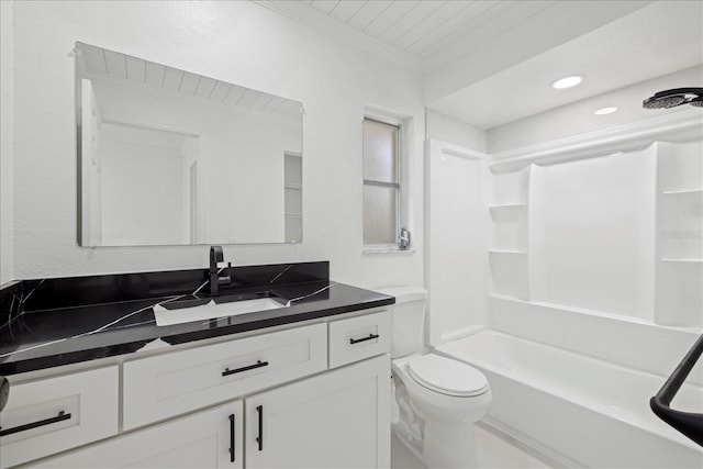 full bathroom featuring toilet, vanity, crown molding, and  shower combination