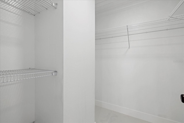 spacious closet featuring tile patterned floors