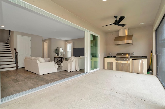 view of patio / terrace with area for grilling, ceiling fan, and a grill