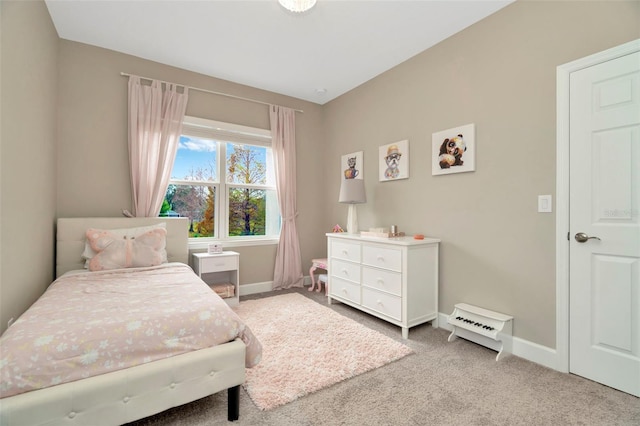 bedroom featuring light colored carpet