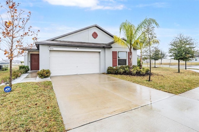 ranch-style house featuring a garage and a front lawn