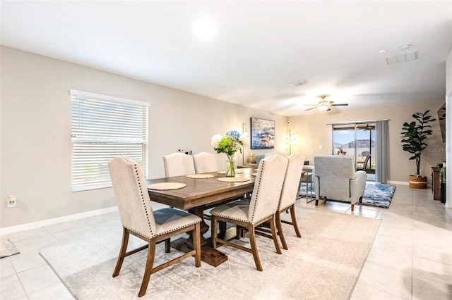 dining room featuring ceiling fan and light tile patterned floors