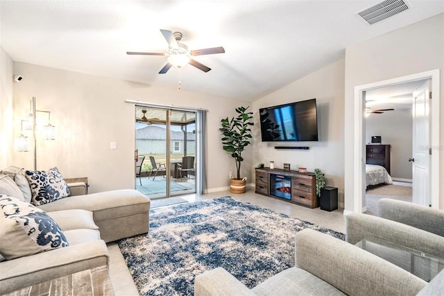 living room featuring ceiling fan and lofted ceiling