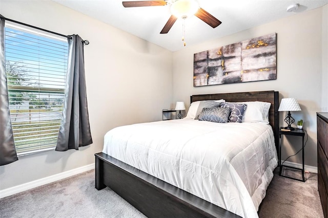 bedroom with ceiling fan and carpet flooring