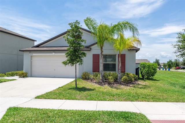 9805 Lemon Drop Loop, Sun City Center, FL 33573 - ranch-style home featuring concrete driveway, an attached garage, stucco siding, and a front lawn