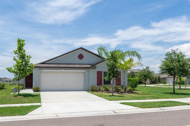 9805 Lemon Drop Loop, Sun City Center, FL 33573 - ranch-style house featuring a garage, driveway, a front yard, and stucco siding