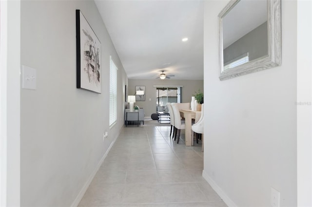 9805 Lemon Drop Loop, Sun City Center, FL 33573 - hall with baseboards and light tile patterned floors