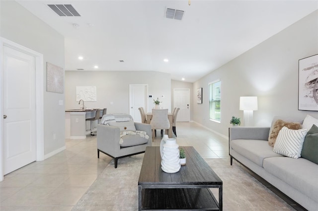 9805 Lemon Drop Loop, Sun City Center, FL 33573 - living room featuring light tile patterned floors, recessed lighting, and baseboards