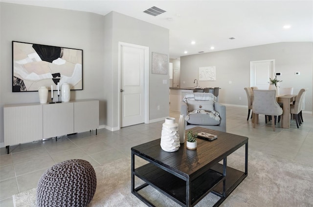 9805 Lemon Drop Loop, Sun City Center, FL 33573 - living area featuring light tile patterned floors, recessed lighting, and baseboards