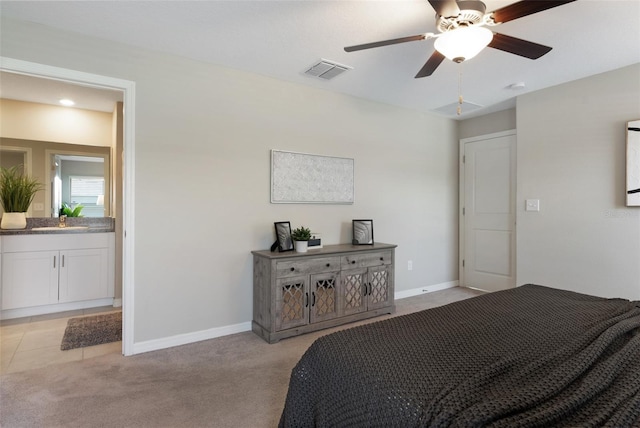9805 Lemon Drop Loop, Sun City Center, FL 33573 - bedroom with a sink, baseboards, light colored carpet, and a ceiling fan