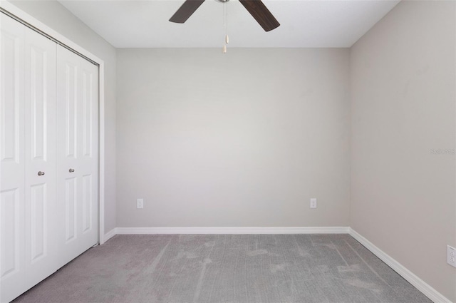 9805 Lemon Drop Loop, Sun City Center, FL 33573 - unfurnished bedroom with carpet flooring, a closet, baseboards, and ceiling fan