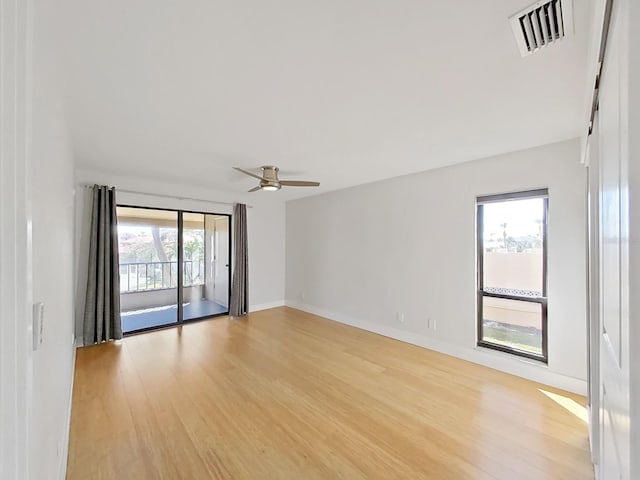 spare room with light hardwood / wood-style flooring and ceiling fan