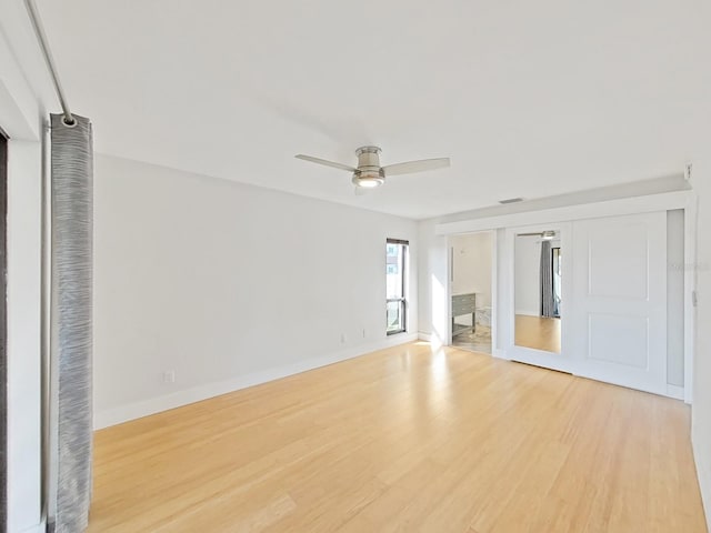 interior space with light hardwood / wood-style floors and ceiling fan