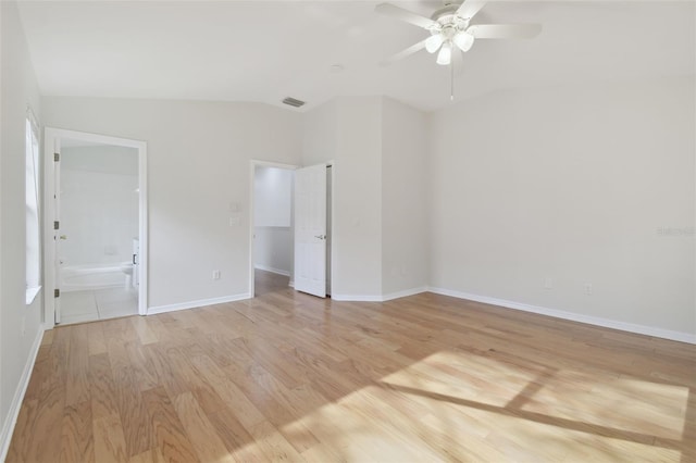 unfurnished room with lofted ceiling, ceiling fan, and light hardwood / wood-style flooring