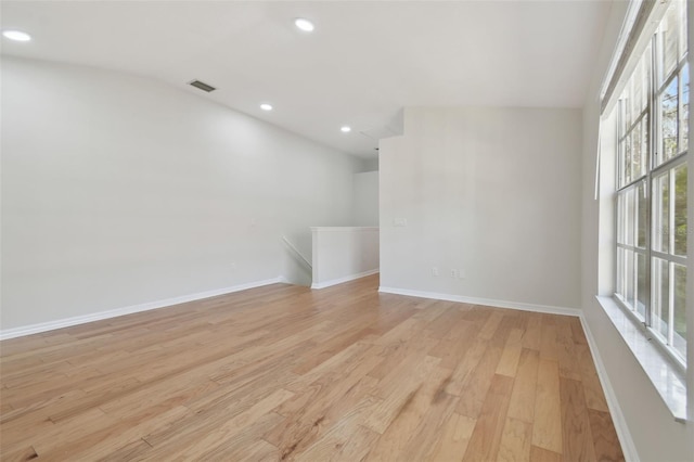 empty room with light hardwood / wood-style flooring