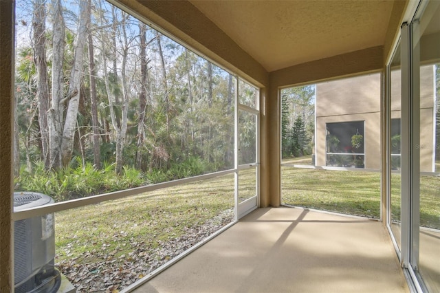 unfurnished sunroom with lofted ceiling