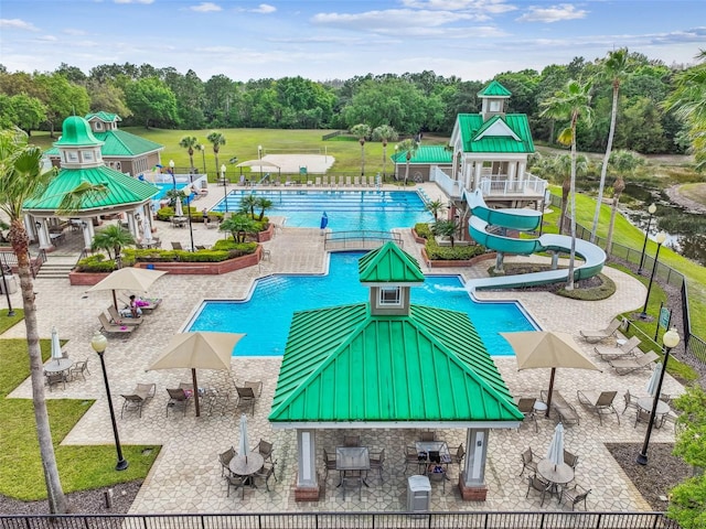 view of pool with a gazebo, a water slide, and a patio area