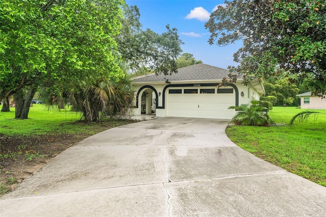 single story home with a garage and a front yard