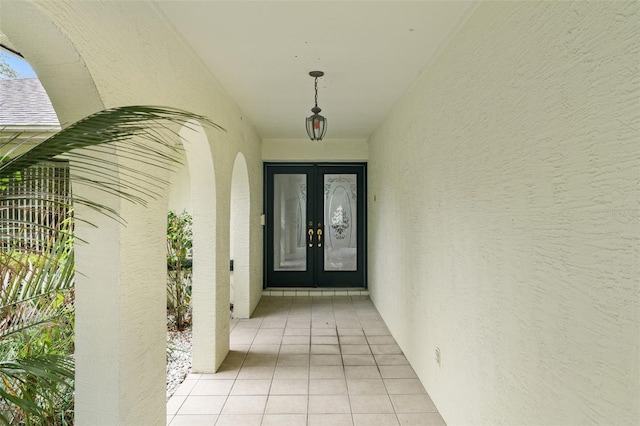 view of exterior entry featuring french doors