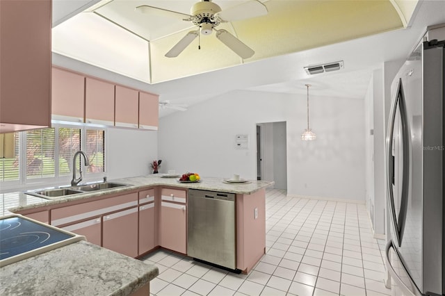 kitchen with kitchen peninsula, sink, light tile patterned floors, and stainless steel appliances