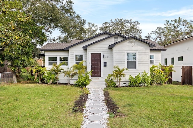 bungalow-style house with a front yard