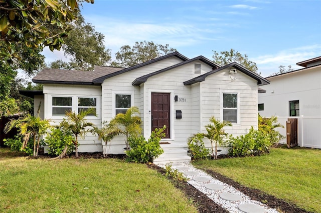 view of front of home with a front lawn