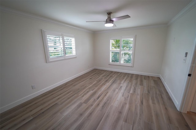 spare room featuring ornamental molding, ceiling fan, and light hardwood / wood-style flooring