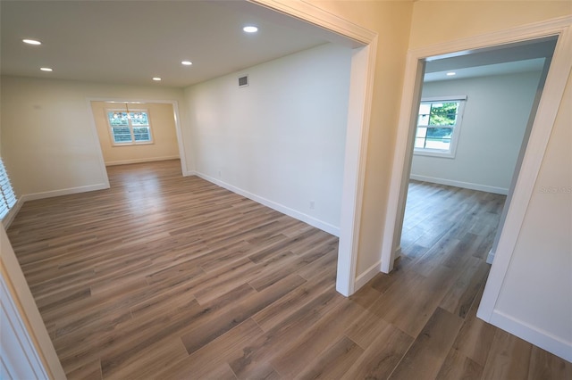 spare room with dark hardwood / wood-style flooring