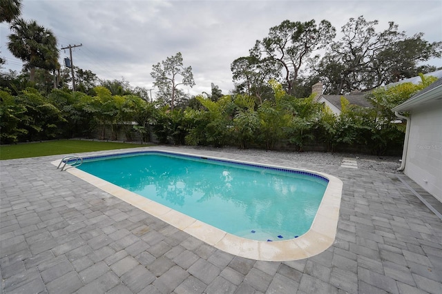 view of swimming pool featuring a patio