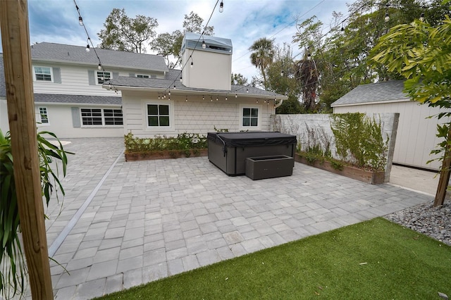 view of patio / terrace with a hot tub